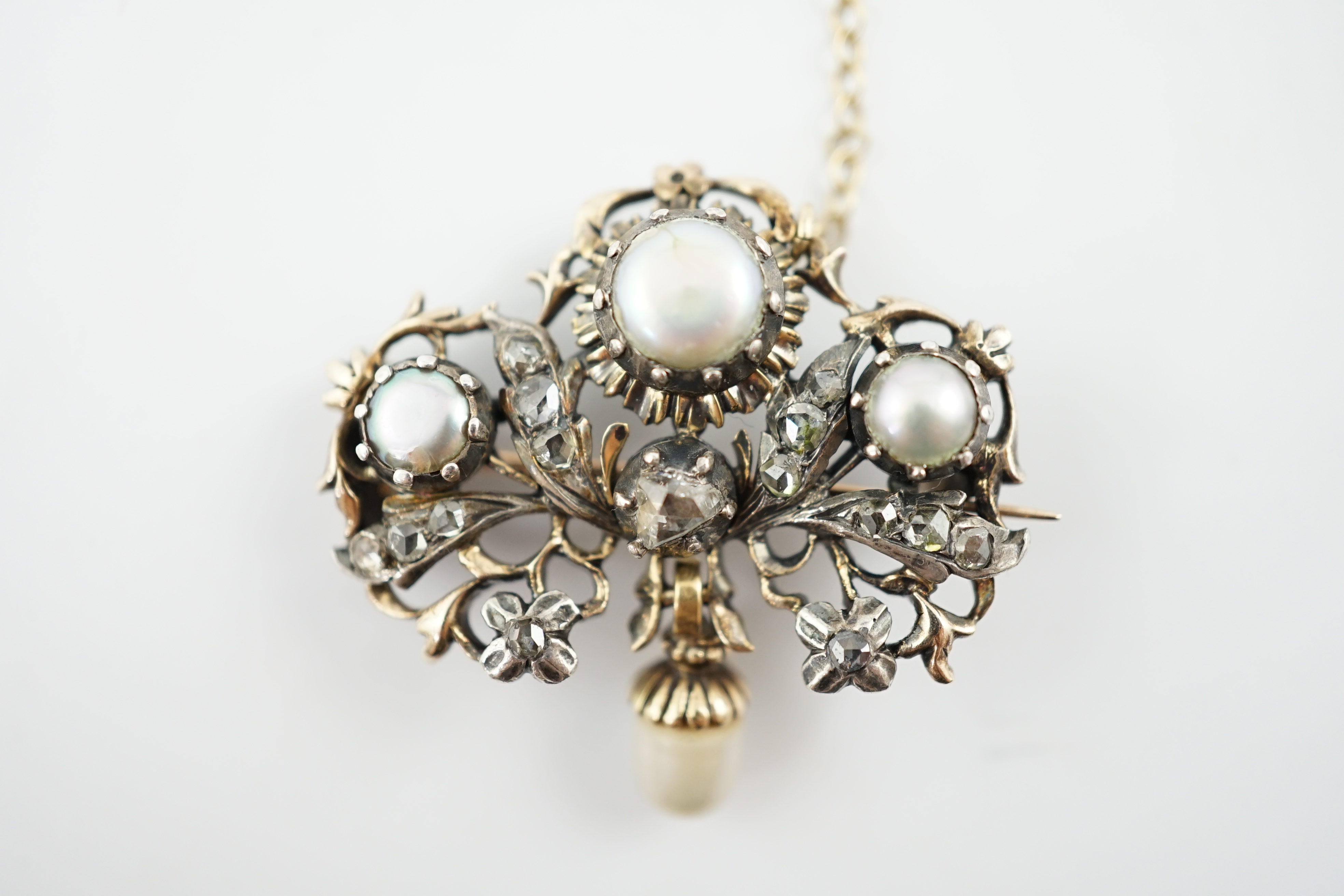 A Victorian gold and silver, button pearl and rose cut diamond cluster set drop brooch